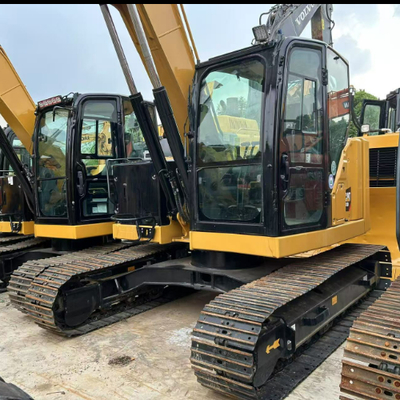 Escavatore idraulico rotante usato Caterpillar CAT 310 per la movimentazione del legno